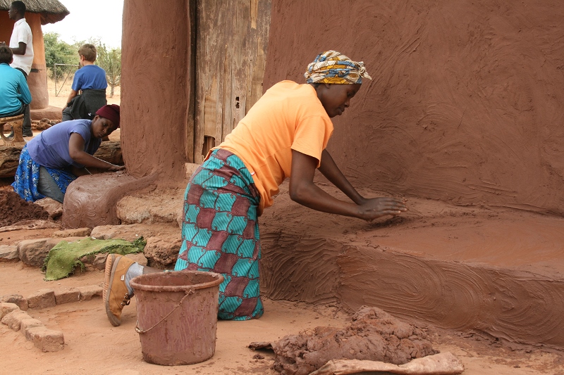 A local village guide welcoming guests on a community tour near Victoria Falls